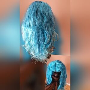 Vibrant, long, wavy, punky, blue wig, With Bangs approximately 25" length.